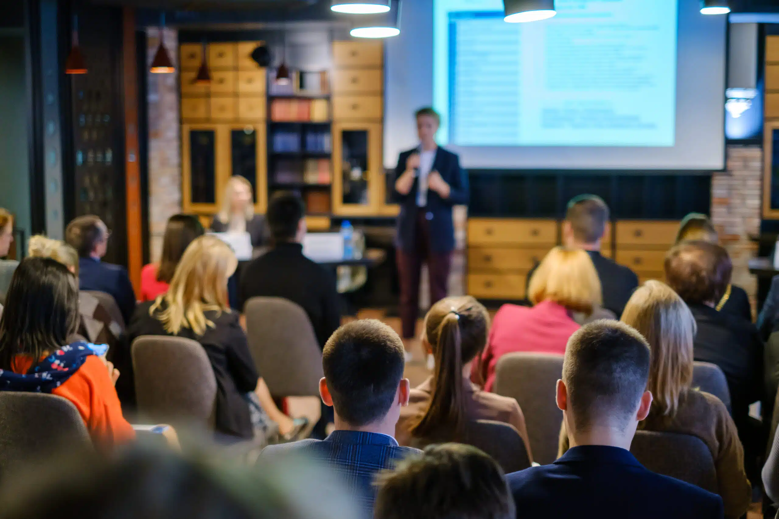 Audience listens lecturer at workshop